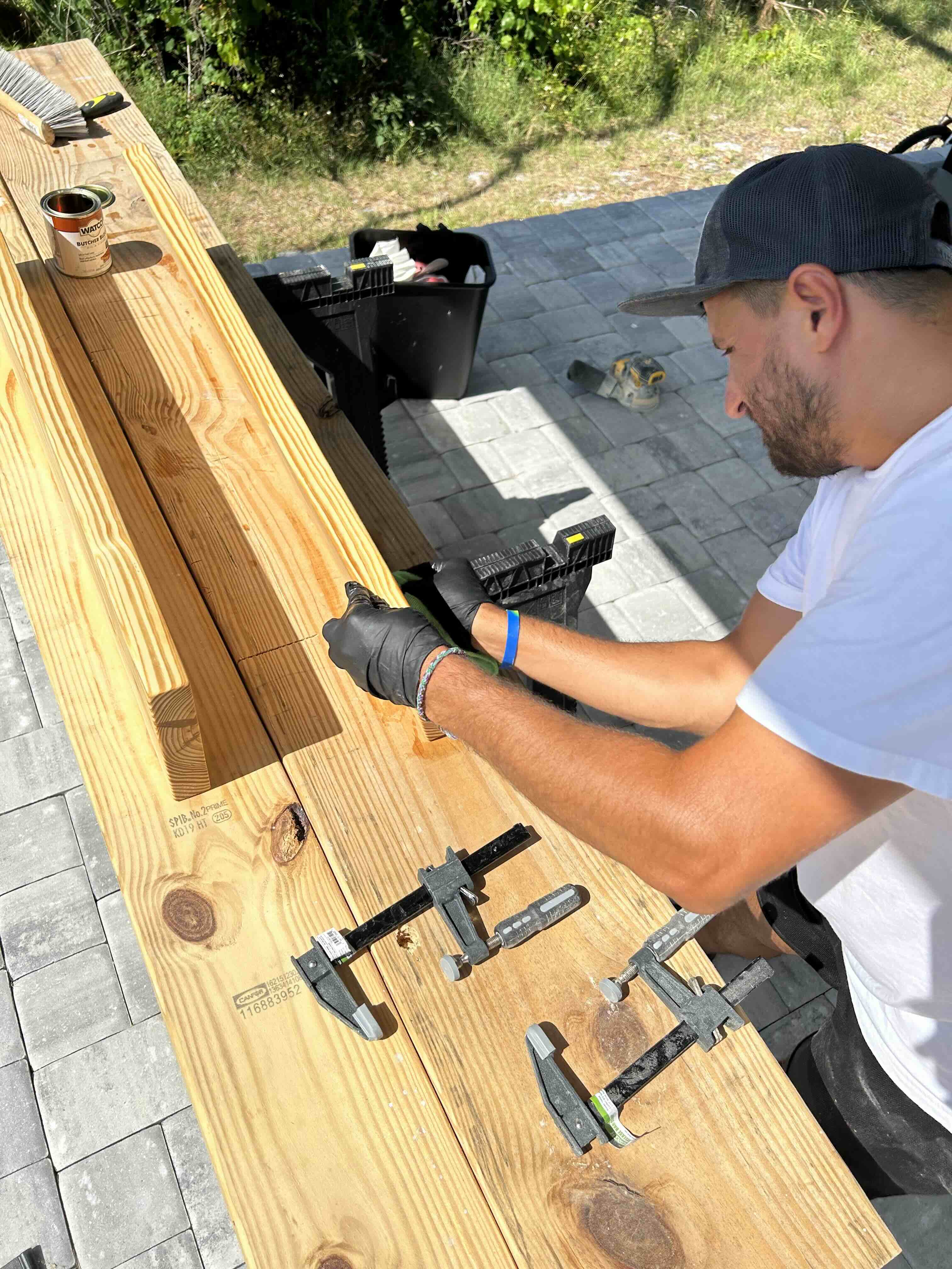 Rus Bezuglyy working on an outdoor wood project